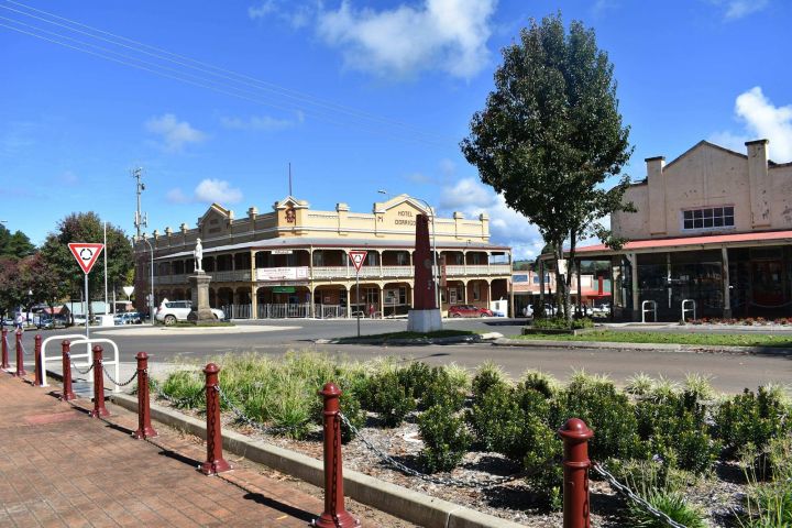 Main street shopfronts Country town main street with a verandah-fronted shop and a heritage hotel