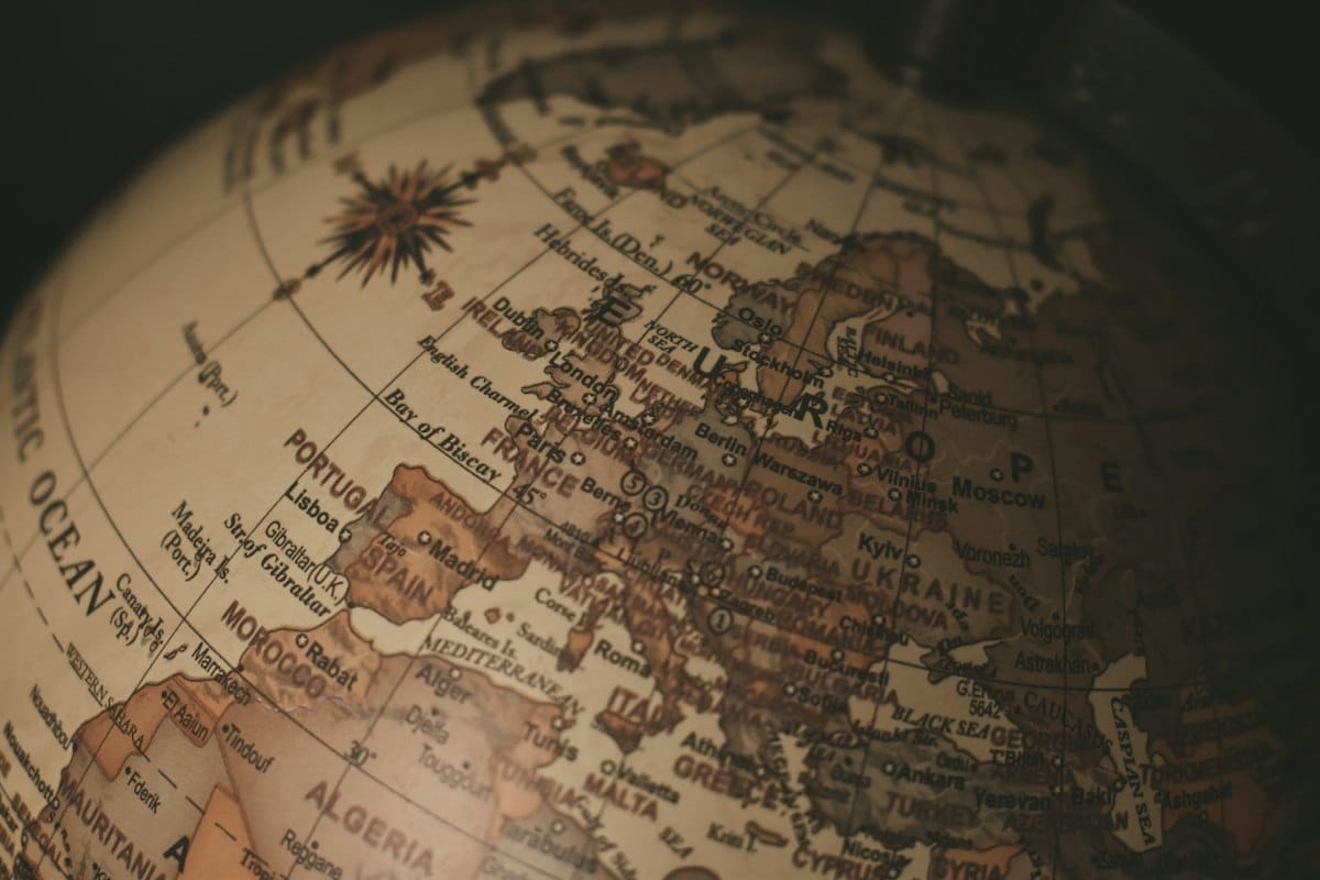 Close-up of an antique globe showing Europe in warm light