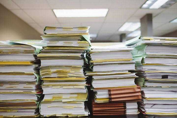 Stacks of files Stacks of paper files and folders on an office desk