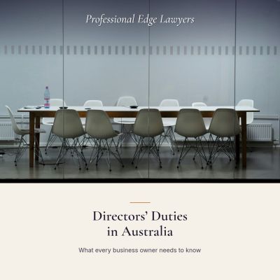 A long meeting table with white chairs in an empty room, with the article title: Directors’ Duties in Australia